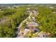 Expansive aerial view of a neighborhood featuring lush green landscaping and mature trees at 32 Allenwood Look, Ormond Beach, FL 32174