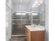 Updated bathroom with tiled shower, vanity, and sliding glass door at 32 Allenwood Look, Ormond Beach, FL 32174