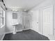 Light and airy bathroom with pedestal sink, walk-in shower, and tiled floor at 32 Allenwood Look, Ormond Beach, FL 32174