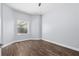 Small bedroom with hardwood floors and a single window at 32 Allenwood Look, Ormond Beach, FL 32174