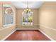 Formal dining room featuring hardwood floors, beautiful natural light, and crown molding details at 32 Allenwood Look, Ormond Beach, FL 32174