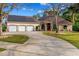 Beautiful single Gathering home with well-manicured lawn, three-car garage, and solar panels at 32 Allenwood Look, Ormond Beach, FL 32174