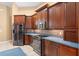 Gourmet kitchen featuring custom cabinets, stainless steel appliances, and tile backsplash at 32 Allenwood Look, Ormond Beach, FL 32174