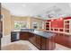 Kitchen with island overlooking the living room with backyard view at 32 Allenwood Look, Ormond Beach, FL 32174