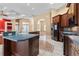 Open kitchen featuring a large island, dark cabinetry, and modern appliances at 32 Allenwood Look, Ormond Beach, FL 32174