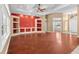 Spacious living room with wood floors, custom built-ins, and bright lighting at 32 Allenwood Look, Ormond Beach, FL 32174
