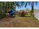 Backyard playground with playset, slide, climbing wall, and swing set at 32 Allenwood Look, Ormond Beach, FL 32174
