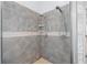 Tile shower with dual shower heads and tiled walls, and glass door at 32 Allenwood Look, Ormond Beach, FL 32174