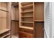 Custom walk-in closet with built-in shelving, drawers, and ample storage space at 32 Allenwood Look, Ormond Beach, FL 32174