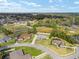 Aerial view of a home with a spacious yard and neighboring houses in a residential area at 5297 Se 39 Loop, Ocala, FL 34480