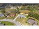Aerial view of a home with a spacious yard and neighboring houses in a residential area at 5297 Se 39 Loop, Ocala, FL 34480
