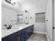 Bathroom featuring dual sinks, vanity cabinets, and modern fixtures at 5297 Se 39 Loop, Ocala, FL 34480