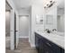 Modern bathroom with a marble vanity top and tiled floors at 5297 Se 39 Loop, Ocala, FL 34480