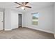 Bedroom with a ceiling fan and large window at 5297 Se 39 Loop, Ocala, FL 34480
