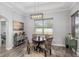Inviting dining area features a round table, patterned chairs, and modern lighting at 5297 Se 39 Loop, Ocala, FL 34480