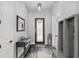 Inviting entryway featuring a decorative front door, stylish rug, and functional console table with modern decor at 5297 Se 39 Loop, Ocala, FL 34480
