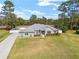 Aerial view of one-story home with a well-manicured front yard at 5297 Se 39 Loop, Ocala, FL 34480