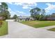 This beautifully maintained home sits on a lush lawn and features manicured landscaping, with a side driveway at 5297 Se 39 Loop, Ocala, FL 34480