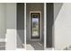 Close up of the front door featuring a screened door with glass inserts at 5297 Se 39 Loop, Ocala, FL 34480