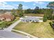 Aerial shot of a well-maintained home with a front lawn and a long driveway at 5297 Se 39 Loop, Ocala, FL 34480