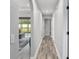 Hallway featuring wood-look flooring that leads to the living room and other rooms at 5297 Se 39 Loop, Ocala, FL 34480