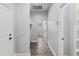Hallway with vinyl floors leads to laundry room at 5297 Se 39 Loop, Ocala, FL 34480