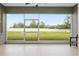 Enclosed lanai featuring serene views of a spacious, green backyard at 5297 Se 39 Loop, Ocala, FL 34480