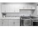 Bright laundry room featuring white cabinets and modern washer and dryer at 5297 Se 39 Loop, Ocala, FL 34480
