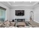 Comfortable living room features a large television and a glimpse into an adjoining bedroom at 5297 Se 39 Loop, Ocala, FL 34480