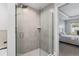 Main bathroom featuring a glass shower enclosure and door leading to the main bedroom at 5297 Se 39 Loop, Ocala, FL 34480