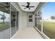 Covered and screened-in patio with a ceiling fan and access to the home's interior at 5297 Se 39 Loop, Ocala, FL 34480