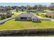 Aerial view of home with a large, fenced yard and screened-in lanai at 5297 Se 39 Loop, Ocala, FL 34480