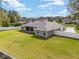 Beautiful home featuring a spacious yard with a white fence and screened-in patio at 5297 Se 39 Loop, Ocala, FL 34480