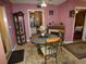 Charming dining room area with a table, four chairs, and built-in display cabinet at 55 Sw Fig Tree Ln, Dunnellon, FL 34431