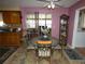 Dining area with a round table and decorative rug at 55 Sw Fig Tree Ln, Dunnellon, FL 34431