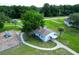 Aerial view of the community building with playground and green space, ideal for Gathering activities at 55 Sw Fig Tree Ln, Dunnellon, FL 34431