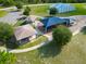 Aerial view of a community playground and covered picnic areas amidst mature trees and green space at 55 Sw Fig Tree Ln, Dunnellon, FL 34431
