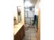 Standard bathroom with a tiled shower, toilet, and cream colored vanity at 9205 Sw 152Nd Pl, Dunnellon, FL 34432