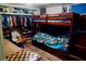 This bedroom features a sturdy wooden bunkbed and ample closet space at 9205 Sw 152Nd Pl, Dunnellon, FL 34432
