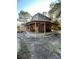 Back exterior featuring a covered patio with lots of space for entertaining at 9205 Sw 152Nd Pl, Dunnellon, FL 34432