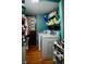 The laundry room features a washer and dryer with hanging space and overhead shelving at 9205 Sw 152Nd Pl, Dunnellon, FL 34432