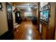 Open living room featuring hardwood floors, an aquarium, and comfortable seating at 9205 Sw 152Nd Pl, Dunnellon, FL 34432
