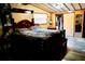 The main bedroom boasts wood floors, ample closet space and a zebra-patterned bed spread at 9205 Sw 152Nd Pl, Dunnellon, FL 34432