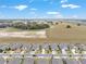 An aerial view of a well-planned community showcases homes with expansive green spaces and scenic views at 9581 Sw 63Rd Loop, Ocala, FL 34481