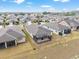 Aerial view showcasing the home's location in a well-planned community with neighboring houses at 9581 Sw 63Rd Loop, Ocala, FL 34481