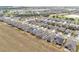 An aerial view of a neighborhood highlighting well-maintained homes along tree-lined streets at 9581 Sw 63Rd Loop, Ocala, FL 34481