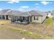This backyard features a covered, screened-in patio, perfect for outdoor relaxation and entertaining at 9581 Sw 63Rd Loop, Ocala, FL 34481