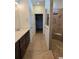 Bathroom featuring a tiled shower, vanity with modern fixtures, and tile flooring at 9581 Sw 63Rd Loop, Ocala, FL 34481