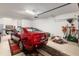 Garage with red car, tools, and peg board at 9581 Sw 63Rd Loop, Ocala, FL 34481