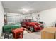 Garage with red car and items at 9581 Sw 63Rd Loop, Ocala, FL 34481